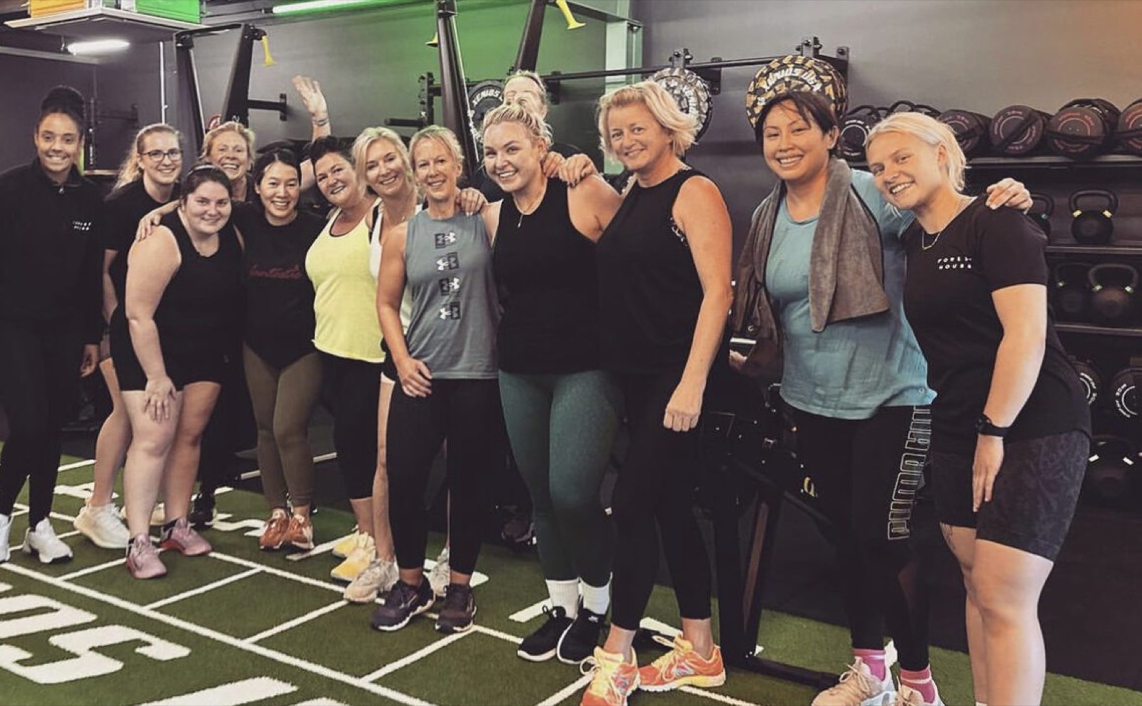 A group of Forest House members and coaches on the studio turf